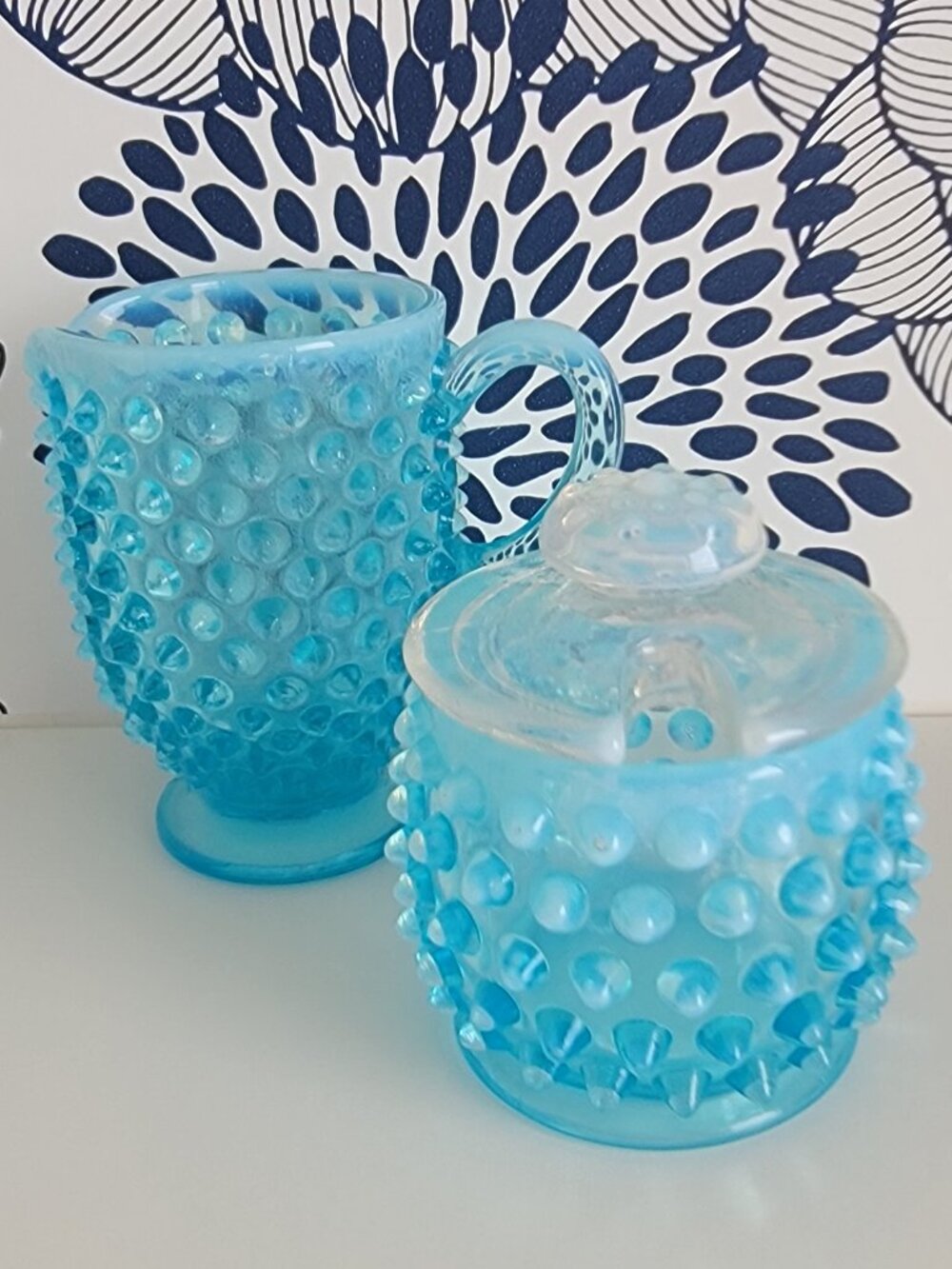 Vintage light blue hobnail glass cream and lidded sugar set.
